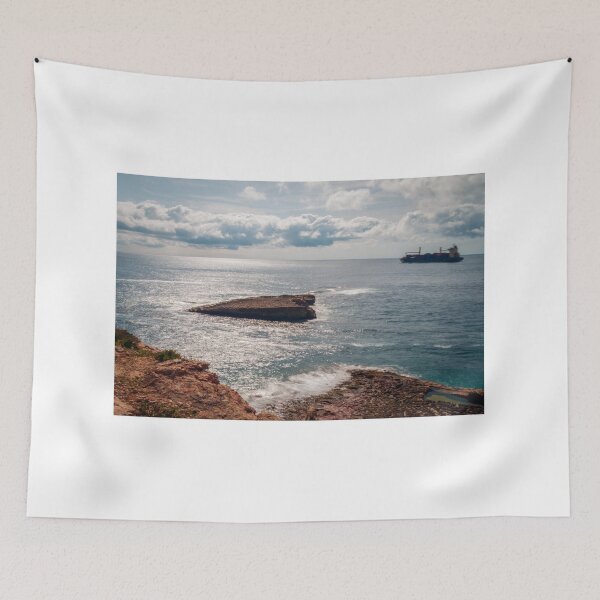 Item preview, Rocky Coastline Overlooking Calm Sea With Cargo Ship on Horizon and Sunlit Waves designed and sold by Nmallia.