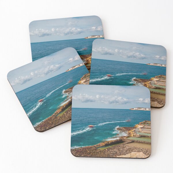 Item preview, Coastal Salt Pans And Rocky Shoreline With Boats Leaving Wakes On Turquoise Sea designed and sold by Nmallia.