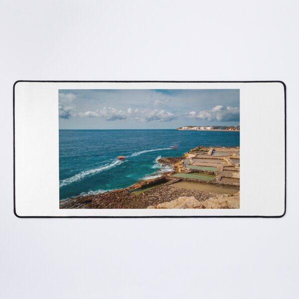 Item preview, Coastal Salt Pans And Rocky Shoreline With Boats Leaving Wakes On Turquoise Sea designed and sold by Nmallia.