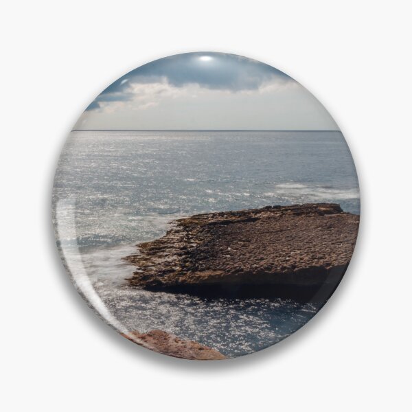 Item preview, Rocky Coastline With Flat Rock Outcrop Extending Into Calm Ocean Under Dramatic Cloudy Sky designed and sold by Nmallia.