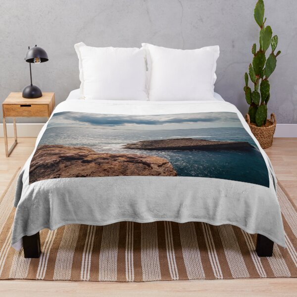 Item preview, Rocky Coastline With Flat Rock Outcrop Extending Into Calm Ocean Under Dramatic Cloudy Sky designed and sold by Nmallia.