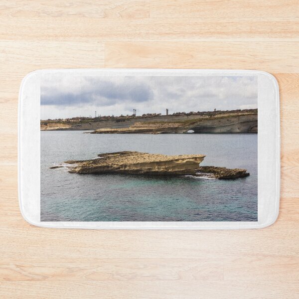 Item preview, Rocky Coastal Sea Stack and Natural Arch With Turquoise Water Under Cloudy Sky designed and sold by Nmallia.