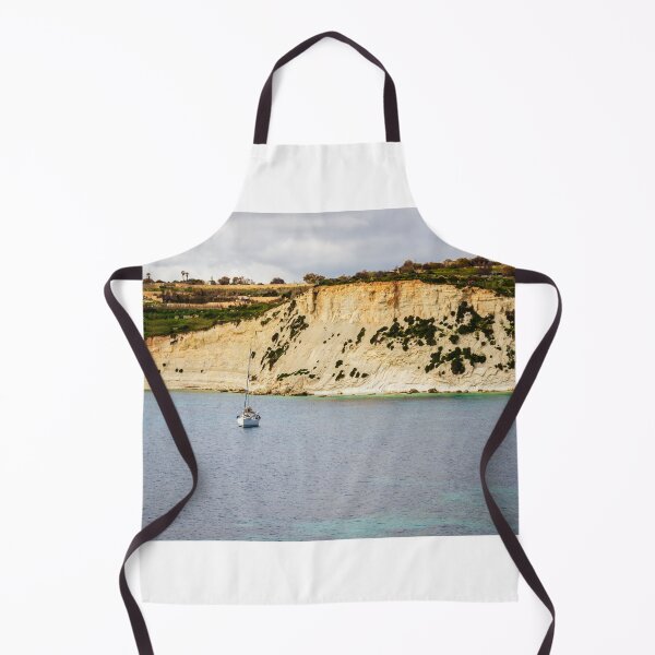 Item preview, Sailboat Anchored Off Rugged Coastal Cliff With Turquoise Sea and Scenic Rocky Shoreline designed and sold by Nmallia.