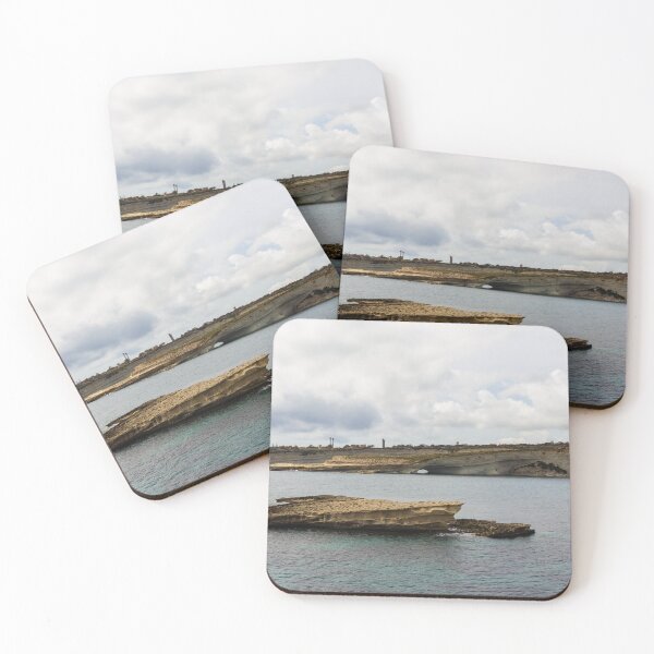 Item preview, Coastal Cliffs and Flat Rock Formation Over Calm Sea With Distant Shoreline and Cloudy Sky designed and sold by Nmallia.