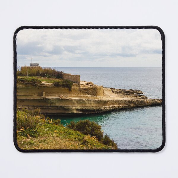 Item preview, Rocky Coastal Cliff Overlooking Calm Blue Sea and Cloudy Horizon With Vegetation in Foreground designed and sold by Nmallia.