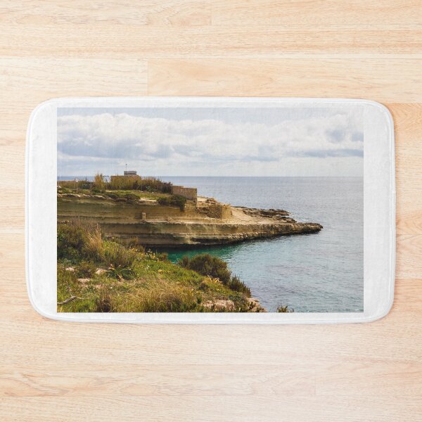 Item preview, Rocky Coastal Cliff Overlooking Calm Blue Sea and Cloudy Horizon With Vegetation in Foreground designed and sold by Nmallia.