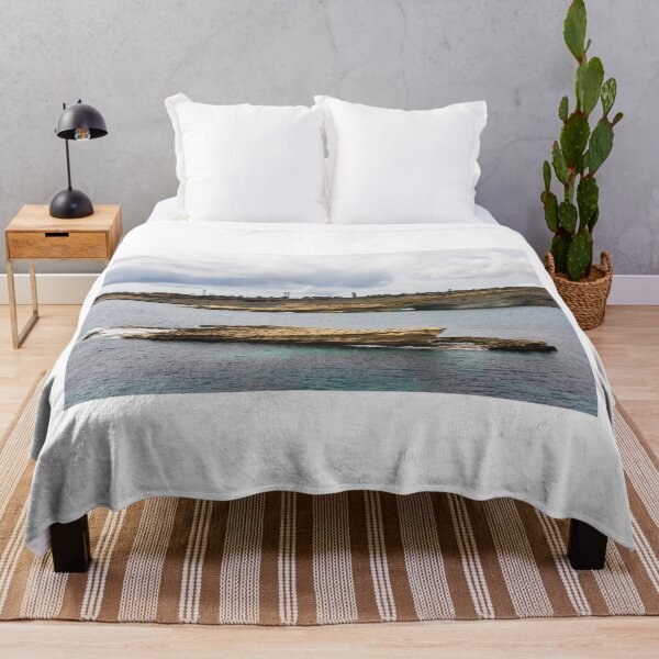 Item preview, Coastal Rock Formation With Sea Arch and Calm Blue Water Under Cloudy Sky designed and sold by Nmallia.