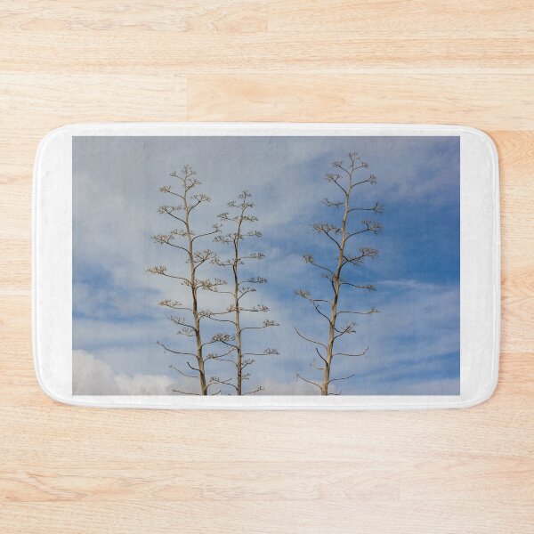 Item preview, Tall Agave Flower Stalks Against Blue Sky With Sparse Branches and Minimalist Composition designed and sold by Nmallia.