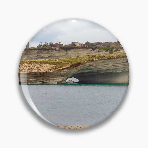 Item preview, Boat Passing Through Natural Coastal Arch Beneath Layered Limestone Cliffs On Calm Sea Under Cloudy Sky designed and sold by Nmallia.