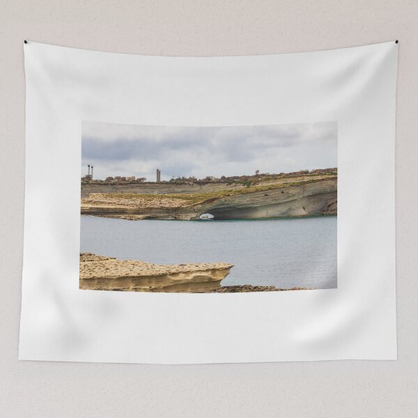 Item preview, Boat Passing Through Natural Coastal Arch Beneath Layered Limestone Cliffs On Calm Sea Under Cloudy Sky designed and sold by Nmallia.