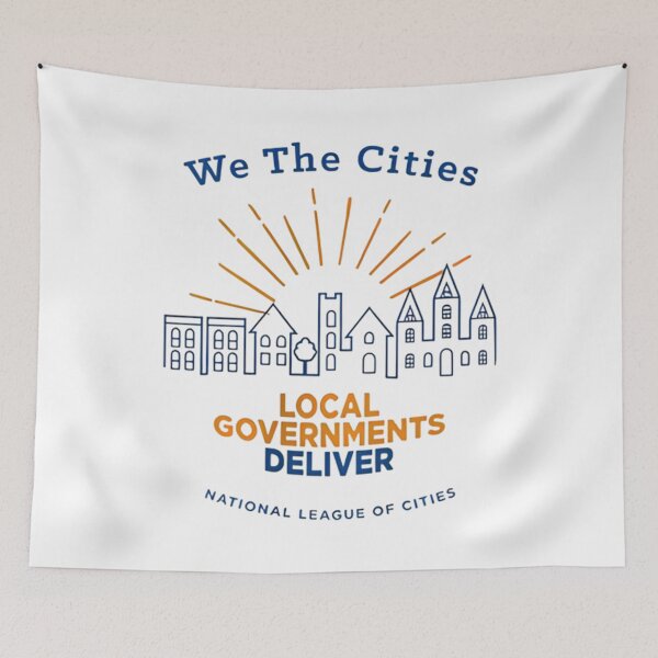 Item preview, We The Cities graphic Raglan Local Governments Deliver, city skyline designed and sold by NonBuyingData.