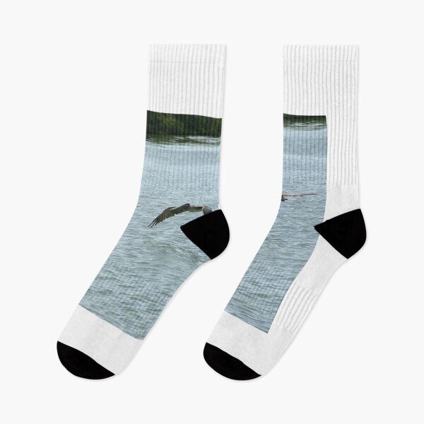 Item preview, Two Pelicans Flying Over Water designed and sold by MercerImages.