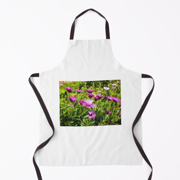Item preview, Purple Daisies Blooming in Sunny Green Garden Bed With Vibrant Spring Flowers designed and sold by Nmallia.