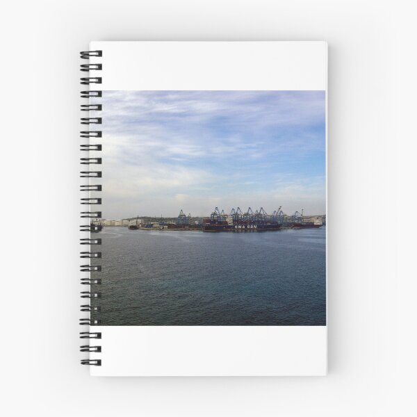 Item preview, Container Ship at Industrial Port With Cranes and Shipping Containers Under Cloudy Sky designed and sold by Nmallia.