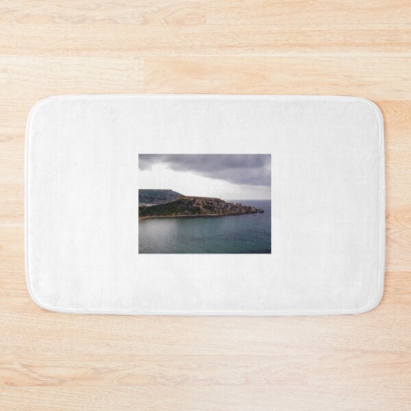 Item preview, Stormy Coastal Cliff Over Turquoise Sea With Rocky Headland And Dramatic Clouds designed and sold by Nmallia.
