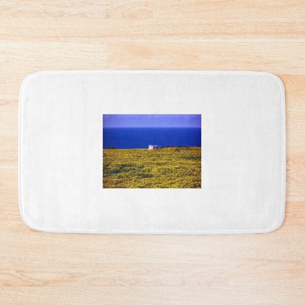 Item preview, Yellow Wildflower Field Overlooking Blue Sea With Small Stone Shelter On Coastal Horizon designed and sold by Nmallia.