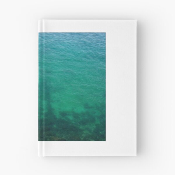 Item preview, Aerial View of Turquoise Ocean Water and Rocky Reef Shadows Over Shallow Sea designed and sold by Nmallia.