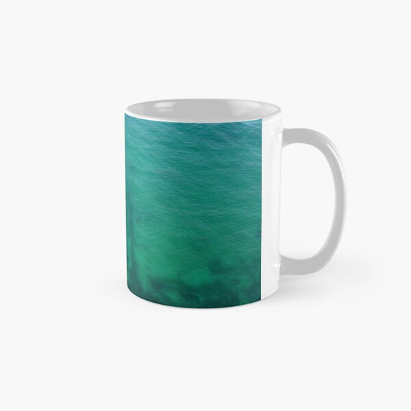 Item preview, Aerial View of Turquoise Ocean Water and Rocky Reef Shadows Over Shallow Sea designed and sold by Nmallia.
