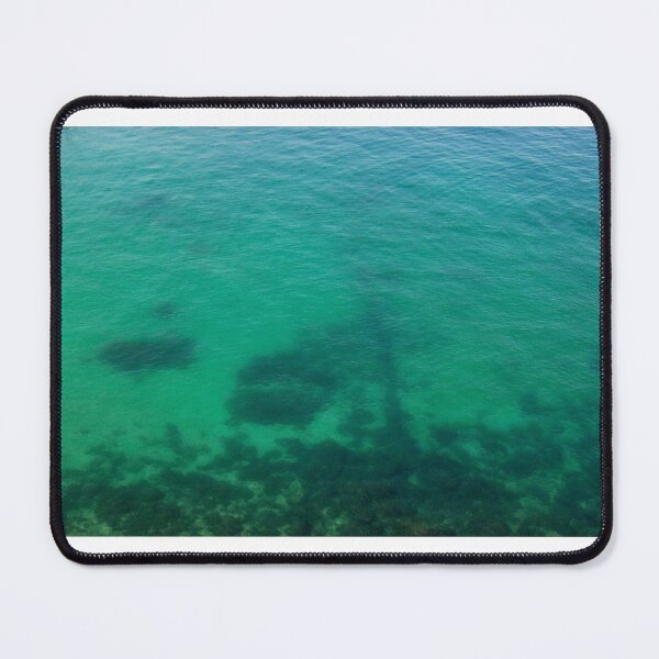 Item preview, Aerial View of Turquoise Ocean Water and Rocky Reef Shadows Over Shallow Sea designed and sold by Nmallia.