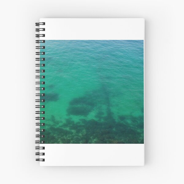 Item preview, Aerial View of Turquoise Ocean Water and Rocky Reef Shadows Over Shallow Sea designed and sold by Nmallia.
