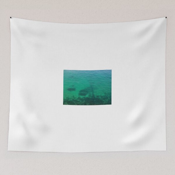 Item preview, Aerial View of Turquoise Ocean Water and Rocky Reef Shadows Over Shallow Sea designed and sold by Nmallia.