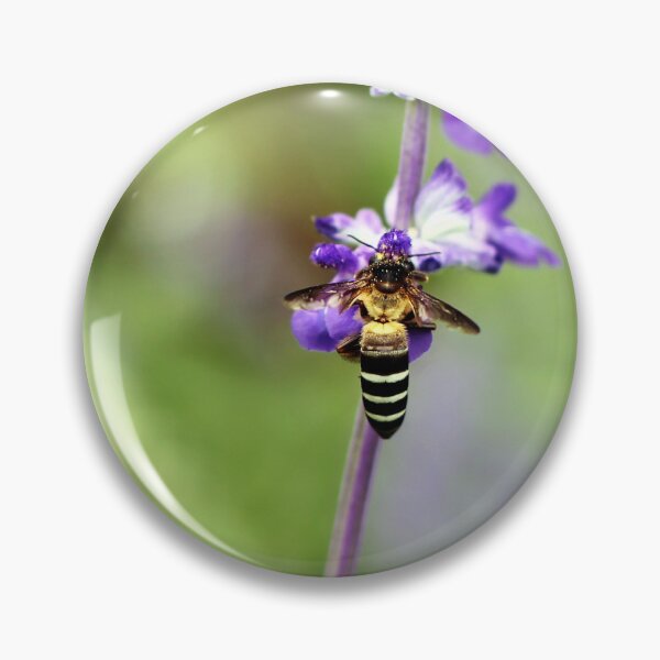 Item preview, Close-up of a bee pollinating a purple and white flower designed and sold by Folkerie.