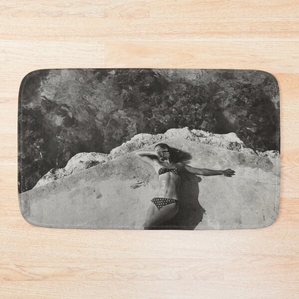 Item preview, Vintage fashion model Natahli (Natalie) Nickerson Paine wearing a bikini, lying on platform near water, Montego Bay, Jamaica black and white photograph poster art print designed and sold by Astrid Arkhangelsky.