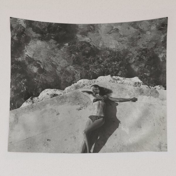 Item preview, Vintage fashion model Natahli (Natalie) Nickerson Paine wearing a bikini, lying on platform near water, Montego Bay, Jamaica black and white photograph poster art print designed and sold by Astrid Arkhangelsky.