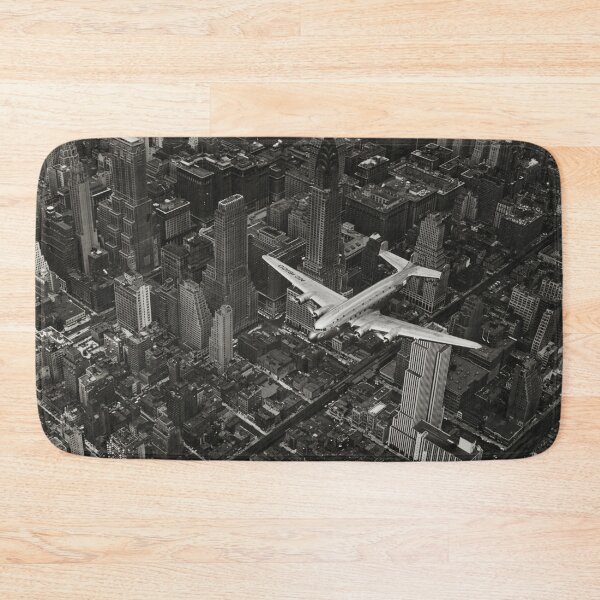 Item preview, A DC-4 Flying Over New York City, 1939, Manhattan skyscrapers and skyline black and white vintage photograph poster art print designed and sold by Astrid Arkhangelsky.