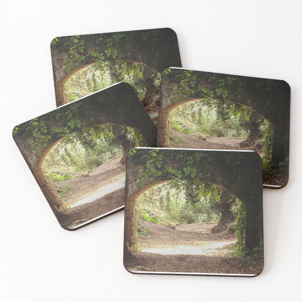 Item preview, Stone Archway Framing a Sunlit Forest Path Through Lush Woodland and Ancient Trees designed and sold by Nmallia.