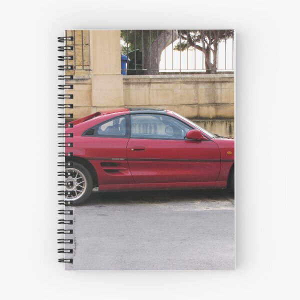 Item preview, Red Sports Coupe Parked On Urban Street Side View With Alloy Wheels And Rear Spoiler designed and sold by Nmallia.