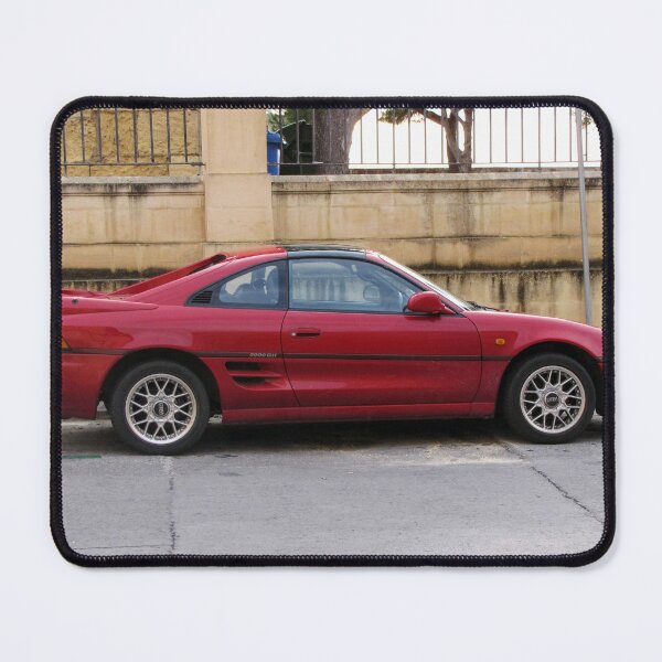 Item preview, Red Sports Coupe Parked On Urban Street Side View With Alloy Wheels And Rear Spoiler designed and sold by Nmallia.