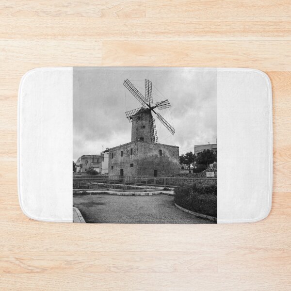 Item preview, Historic Stone Windmill With Large Sails Against Moody Sky in Urban Mediterranean Setting designed and sold by Nmallia.