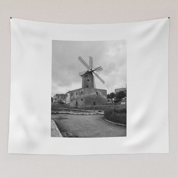 Item preview, Historic Stone Windmill With Large Sails Against Moody Sky in Urban Mediterranean Setting designed and sold by Nmallia.