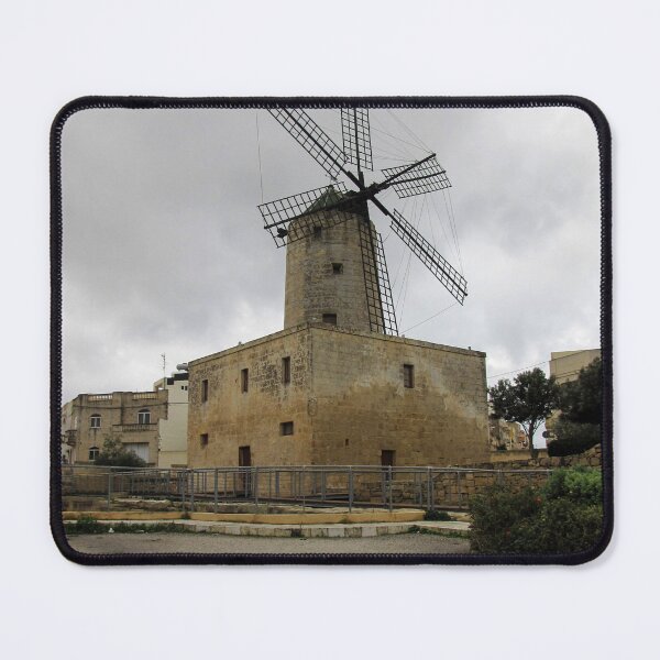 Item preview, Historic Stone Windmill Against Moody Overcast Sky With Old Town Buildings And Path designed and sold by Nmallia.