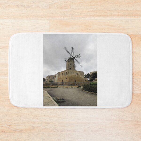 Item preview, Historic Stone Windmill Against Moody Overcast Sky With Old Town Buildings And Path designed and sold by Nmallia.