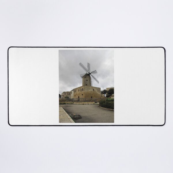 Item preview, Historic Stone Windmill Against Moody Overcast Sky With Old Town Buildings And Path designed and sold by Nmallia.