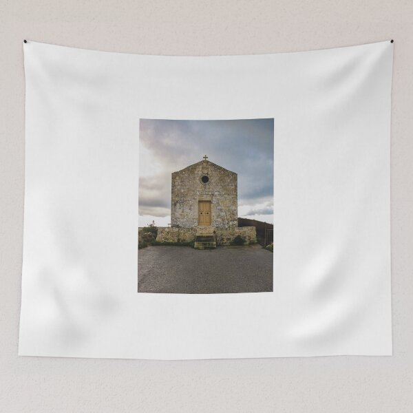 Item preview, Historic Stone Chapel With Cross on Cliffside and Entrance Steps Under Dramatic Cloudy Sky designed and sold by Nmallia.