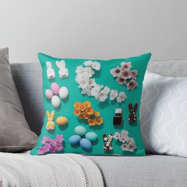 Item preview, Colorful Easter decorations with eggs, flowers, and bunny figurines on teal background designed and sold by Stellar Geometry.
