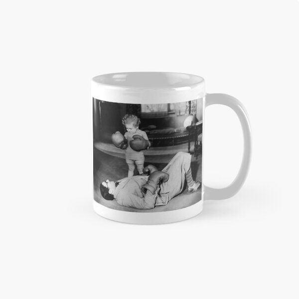 Item preview, TKO, vintage little girl knocks out her father, funny girl power black and white photograph poster art print designed and sold by Astrid Arkhangelsky.