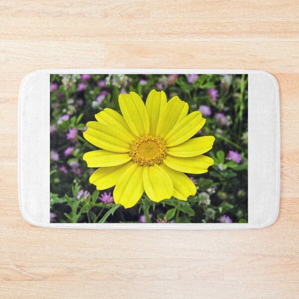 Item preview, Bright Yellow Daisy Bloom Close-Up With Green Foliage And Purple Wildflowers Background designed and sold by Nmallia.