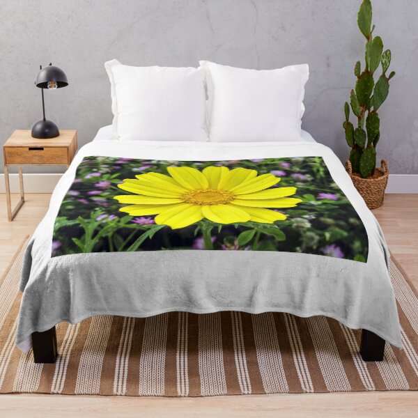 Item preview, Bright Yellow Daisy Bloom Close-Up With Green Foliage And Purple Wildflowers Background designed and sold by Nmallia.