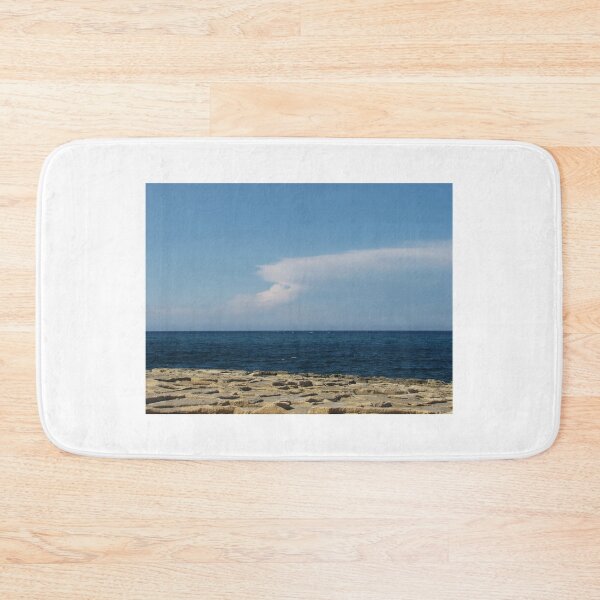Item preview, Calm Blue Sea and Rocky Shore with Distant Clouds on a Clear Sunny Day designed and sold by Nmallia.