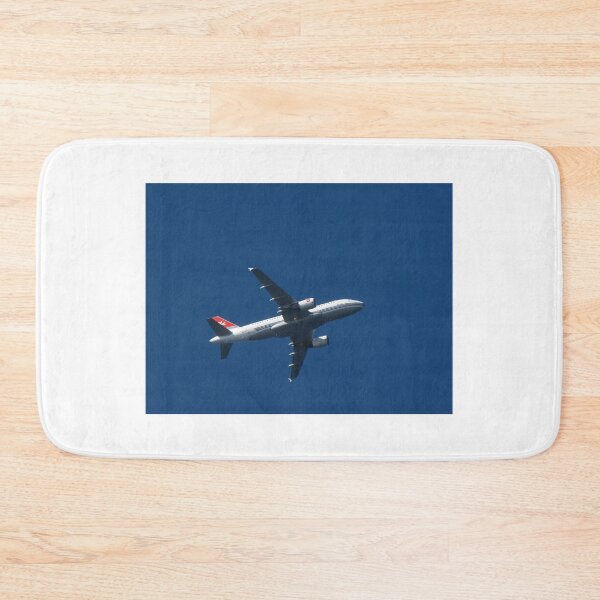 Item preview, Commercial Airplane Flying High Over Clear Blue Sky Viewed From Below In Midair designed and sold by Nmallia.