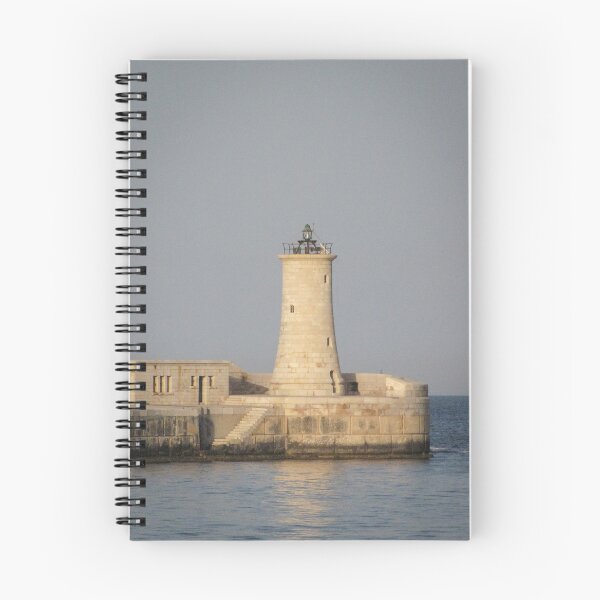 Item preview, Stone Lighthouse on Harbor Breakwater at Sunset Over Calm Sea With Reflection designed and sold by Nmallia.