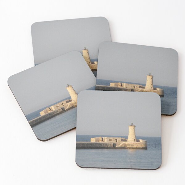 Item preview, Stone Lighthouse on Harbor Breakwater at Sunset Over Calm Sea With Reflection designed and sold by Nmallia.