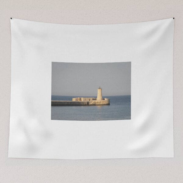 Item preview, Stone Lighthouse on Harbor Breakwater at Sunset Over Calm Sea With Reflection designed and sold by Nmallia.