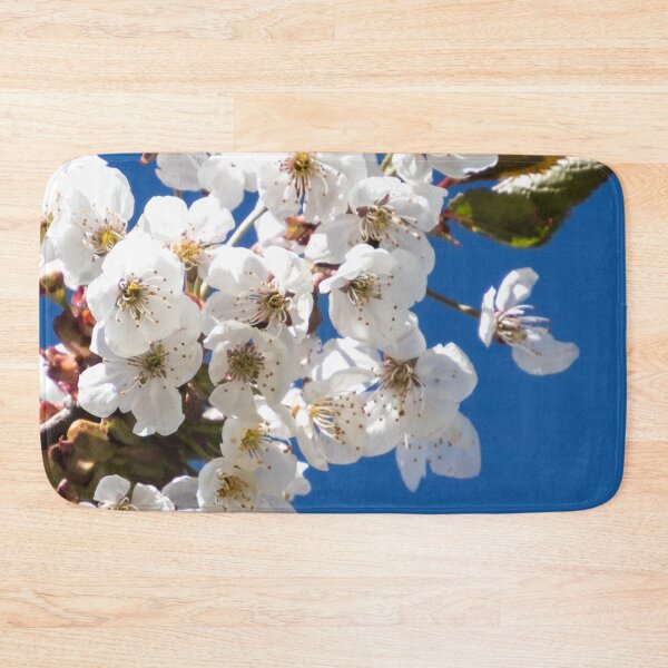 Item preview, White blossoms against a blue sky – spring flower nature photography designed and sold by Katja LebenFreude.