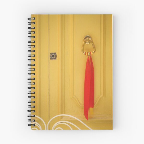 Item preview, Yellow Wooden Door With Brass Knocker And Red Ribbon Decoration On Vintage Entrance designed and sold by Nmallia.