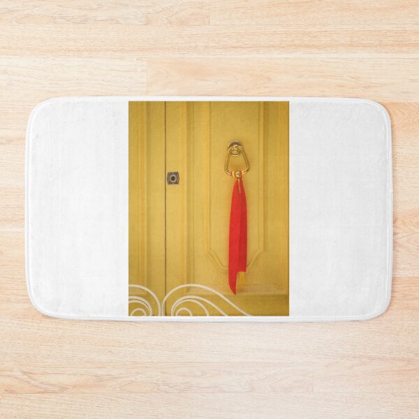 Item preview, Yellow Wooden Door With Brass Knocker And Red Ribbon Decoration On Vintage Entrance designed and sold by Nmallia.
